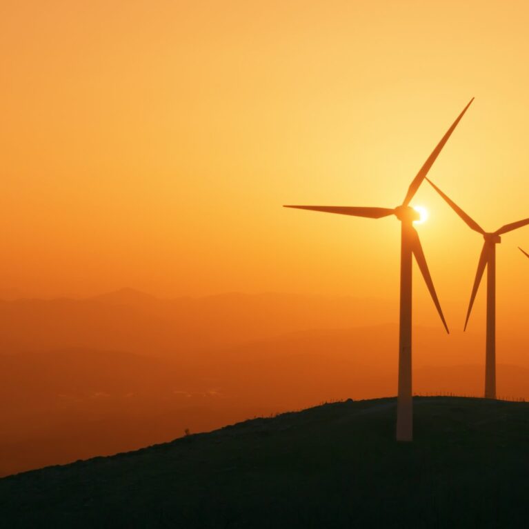 wind turbines at sunset